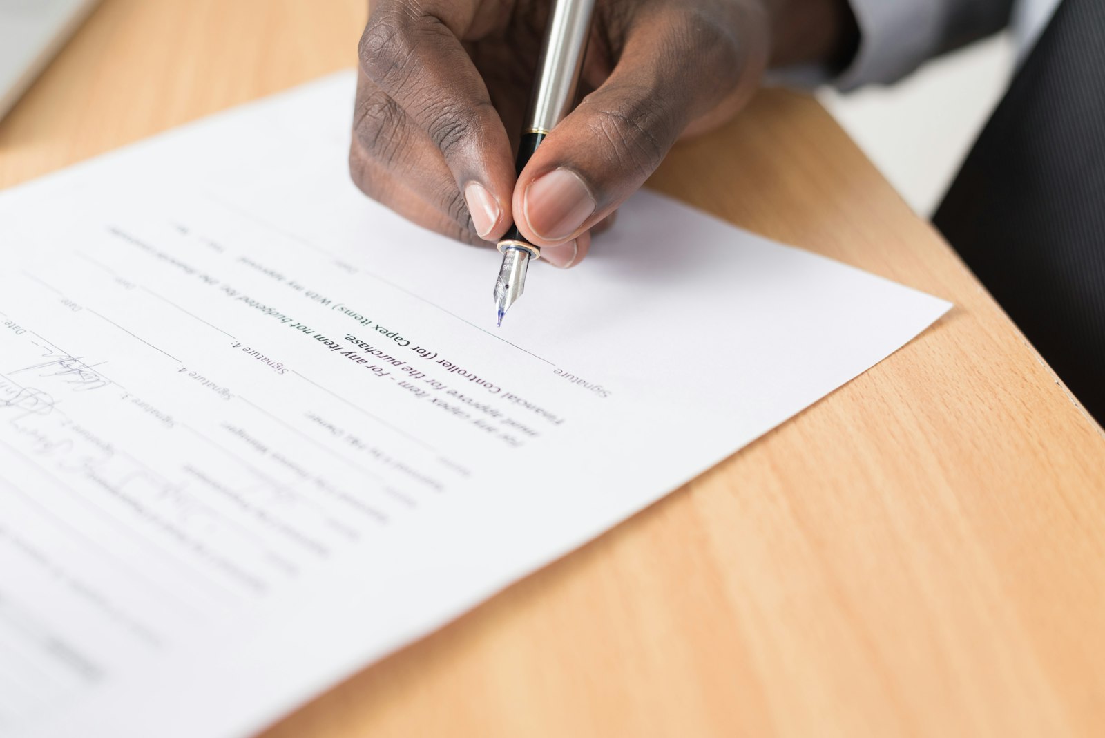 Client signing an estate planning document